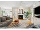 Cozy living room features a fireplace, built-in shelving, and hardwood floors at 3277 Richards Xing, Fort Mill, SC 29708