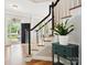 Elegant staircase with a dark wood railing at 3277 Richards Xing, Fort Mill, SC 29708