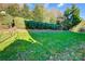 Landscaped backyard with lush green grass and shrubs at 3405 Taviston Dr, Waxhaw, NC 28173