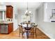 Kitchen features a charming dining area with hardwood floors and a round table at 3405 Taviston Dr, Waxhaw, NC 28173