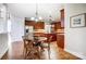 Kitchen dining area with hardwood floors and wooden table at 3405 Taviston Dr, Waxhaw, NC 28173