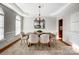 Elegant dining room with hardwood floors and chandelier at 3405 Taviston Dr, Waxhaw, NC 28173