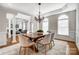 Formal dining room with hardwood floors, chandelier, and large windows at 3405 Taviston Dr, Waxhaw, NC 28173