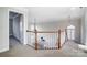 Upstairs hallway overlooking the living room at 3405 Taviston Dr, Waxhaw, NC 28173