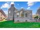 Brick house exterior with a sunroom and landscaping at 3405 Taviston Dr, Waxhaw, NC 28173