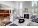 Living room with hardwood floors, fireplace and kitchen view at 3405 Taviston Dr, Waxhaw, NC 28173