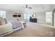 Spacious main bedroom with a ceiling fan, neutral walls and carpet at 3405 Taviston Dr, Waxhaw, NC 28173