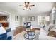 Sunroom with vaulted ceiling, hardwood floors, and ample natural light at 3405 Taviston Dr, Waxhaw, NC 28173