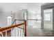 Upstairs hallway with hardwood floors, a chandelier, and views to bedrooms at 3405 Taviston Dr, Waxhaw, NC 28173