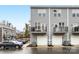 Rear view of townhouses showcasing balconies and garages at 4027 Capital Ridge Ct # 10, Charlotte, NC 28205