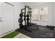 Bright garage gym featuring squat rack and weight bench at 4027 Capital Ridge Ct # 10, Charlotte, NC 28205