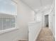 Upstairs hallway with carpeted flooring and natural light at 4027 Capital Ridge Ct # 10, Charlotte, NC 28205