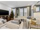 Elegant living room showcasing a white sectional sofa and Christmas tree at 4027 Capital Ridge Ct # 10, Charlotte, NC 28205