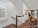 Modern staircase with white railings and wood steps at 4027 Capital Ridge Ct # 10, Charlotte, NC 28205