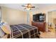 Main bedroom with large TV and ensuite bathroom access at 415 Kilberry Ln, Fort Mill, SC 29715