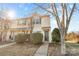 Beige townhome with dark door, landscaping, and walkway at 415 Kilberry Ln, Fort Mill, SC 29715