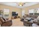 Living room with sectional sofa, TV, and recliner at 415 Kilberry Ln, Fort Mill, SC 29715