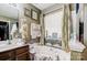 Relaxing bathroom with a large bathtub and double sinks at 502 Long Creek Pkwy, Charlotte, NC 28214