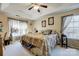 Spacious main bedroom with king-size bed and floral bedding at 502 Long Creek Pkwy, Charlotte, NC 28214