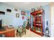 Home office with desk, chair, and display cabinet at 502 Long Creek Pkwy, Charlotte, NC 28214