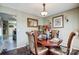 Elegant dining room, featuring a wood table and four ornate chairs at 502 Long Creek Pkwy, Charlotte, NC 28214