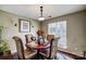 Formal dining room with wood table and four chairs, offering natural light at 502 Long Creek Pkwy, Charlotte, NC 28214