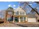 Two-story brick home with green shutters, attached garage, and landscaped yard at 502 Long Creek Pkwy, Charlotte, NC 28214