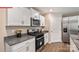 Modern kitchen featuring stainless steel appliances and granite countertops at 522 Zermatt Ct, Monroe, NC 28112