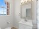 Clean bathroom with a white vanity and updated fixtures at 5774 Crown Ter, Hickory, NC 28601