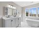 Elegant bathroom with double vanity, soaking tub, and marble accents at 5774 Crown Ter, Hickory, NC 28601