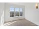 Well-lit bedroom featuring a large window and neutral wall colors at 5774 Crown Ter, Hickory, NC 28601