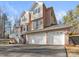 Two-story brick house with a three-car garage and a white front door at 5774 Crown Ter, Hickory, NC 28601