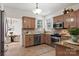 Traditional kitchen with wood cabinets, stainless steel appliances, and tiled floor at 5774 Crown Ter, Hickory, NC 28601