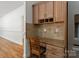 Built-in kitchen desk with granite countertop and wood cabinetry at 5774 Crown Ter, Hickory, NC 28601