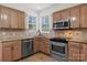 Modern kitchen with granite countertops and stainless steel appliances at 5774 Crown Ter, Hickory, NC 28601