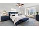Elegant main bedroom with navy bed frame, bay window, and complementary decor at 5774 Crown Ter, Hickory, NC 28601