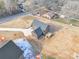 Aerial view of a house, detached garage, and driveway at 591 Shiloh Rd, Statesville, NC 28677