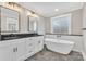 Elegant bathroom with double vanity, soaking tub, and modern fixtures at 591 Shiloh Rd, Statesville, NC 28677