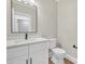 Simple bathroom with white vanity, black faucet, and frameless mirror at 591 Shiloh Rd, Statesville, NC 28677