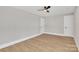 Light-filled bedroom with wood flooring and white doors at 591 Shiloh Rd, Statesville, NC 28677