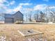 Two-story house with deck and fire pit in the backyard at 591 Shiloh Rd, Statesville, NC 28677