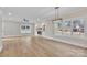 Bright living room with hardwood floors, fireplace, and large windows at 591 Shiloh Rd, Statesville, NC 28677