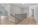 Upstairs hall with hardwood floors and stylish railing at 591 Shiloh Rd, Statesville, NC 28677