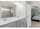 Double vanity bathroom with gray cabinets and a shower at 6014 Cadence Ln, Fort Mill, SC 29707