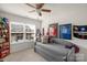 Bedroom with a daybed, ceiling fan, and sports memorabilia at 6014 Cadence Ln, Fort Mill, SC 29707