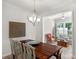 Bright dining area with wooden table and view to sunroom at 6014 Cadence Ln, Fort Mill, SC 29707