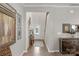 Bright entryway with hardwood floors, showcasing a staircase and gallery wall at 6014 Cadence Ln, Fort Mill, SC 29707