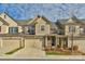 Brick front exterior of charming townhome with 2-car garage at 6014 Cadence Ln, Fort Mill, SC 29707