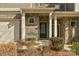 Front entry of townhome with brick exterior and bench at 6014 Cadence Ln, Fort Mill, SC 29707