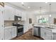 Modern kitchen with stainless steel appliances and white cabinets at 6014 Cadence Ln, Fort Mill, SC 29707